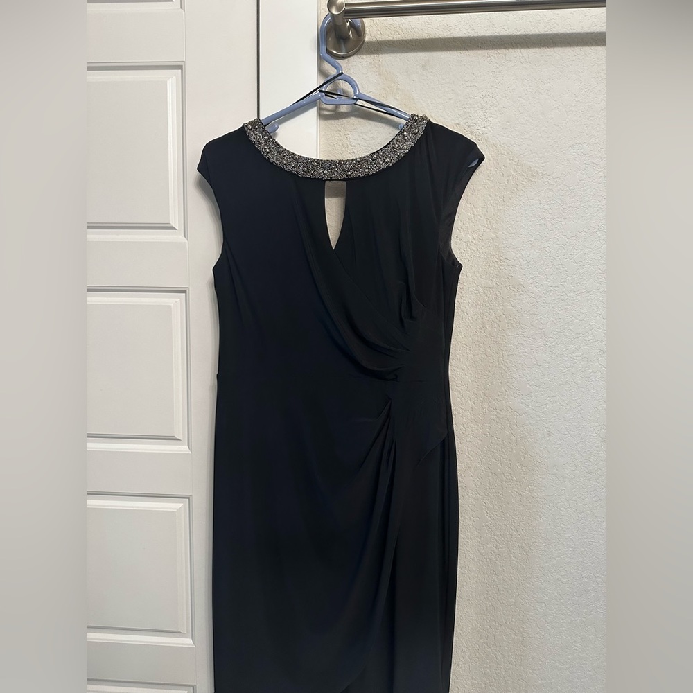 Black formal dress for sale. Flattering hip hugging style and beautiful detail.